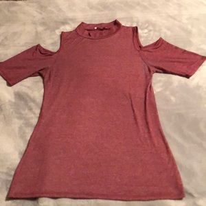 a cut out sleeve shirt with a turtle neck